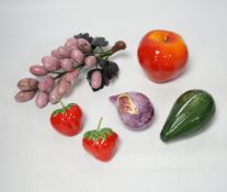 Five polished hardstone and soapstone bunches of grapes and six glazed china fruits, banana 19cm