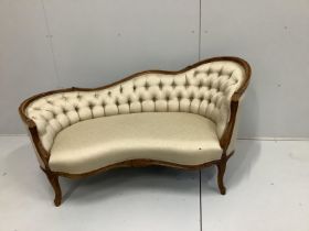 An early 20th century Louis XVI style beech button back show-wood couch, with carved and moulded