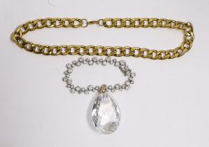 A gilt metal curblink necklace, a white metal paste set bracelet stamped 925 and a rock crystal
