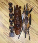 A large collection of various African carvings, masks etc