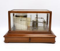 A 20th century barograph by Tycos, in a mahogany case with bevelled glass panels and incorporating