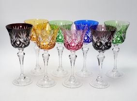 Eight Bohemian cut glass and coloured overlay wine glasses on cut tapering stems
