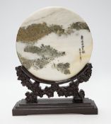 A 20th century Chinese marble plaque displaying cloud formations, on carved wood stand, 26cm
