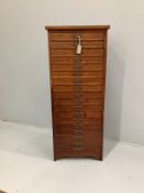 A Chinese elm eighteen drawer tall chest, width 56cm, depth 34cm, height 136cm