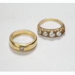 An early 20th century yellow metal and graduated split pearl set half hoop ring, with diamond chip