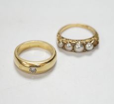 An early 20th century yellow metal and graduated split pearl set half hoop ring, with diamond chip