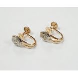 A pair of 14k gold and brilliant cut diamond earrings