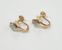 A pair of 14k gold and brilliant cut diamond earrings