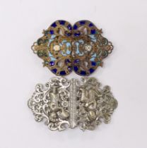 An Indian style silver plated belt buckle and another enamelled