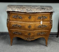 A Louis XVI style gilt metal mounted inlaid kingwood marble topped serpentine bombe commode, width