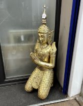 A large 20th century Thai giltwood guardian angel temple figure inset coloured glass decoration,