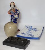 A 20th century Chinese porcelain figure, a stoneware jar, a ‘dragon’ inkstone and a Japanese dish,