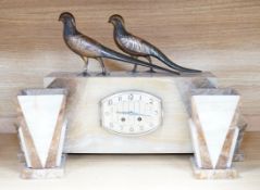An Art Deco clock garniture, bronze mounted, signed segundo, with gilt bronze birds on top, height