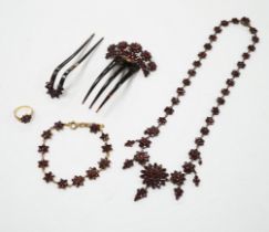 A Victorian garnet set gilt metal and tortoiseshell suite of jewellery comprising bracelet,