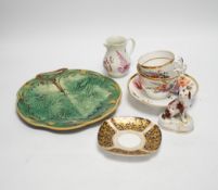Continental porcelain: four putti ornaments, a Staffordshire dog, green leaf plate, a napkin ring