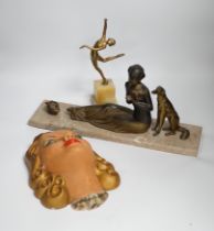 An Art Deco model of a seated lady with a dog and doves, together with a figure of dancing girl