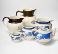 A group of Staffordshire white stonewares: five jugs and a teapot, including Adams, tallest jug 21cm