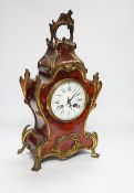 A French red tortoiseshell and gilt metal mounted mantel clock, 40cm high