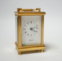 An Angelus miniature brass cased carriage clock with key, 9cm