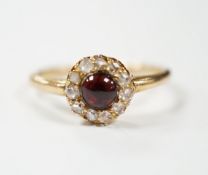 An 18ct, foil backed cabochon and diamond cluster set dress ring, by Annina Vogel, size M/N, gross