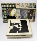 Twenty-four LP albums by Brian Eno, Talking Heads, Lou Reed and David Bowie, albums include Taking