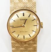 A lady's modern 9ct gold Tissot Stylist manual wind bracelet wrist watch, overall 16.5cm, gross