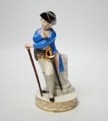 A late 19th century Meissen figure of an officer looking at his watch, incised F64 and impressed