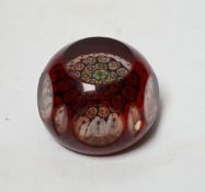 A 19th century ruby overlaid cut glass paperweight, 6cm diameter