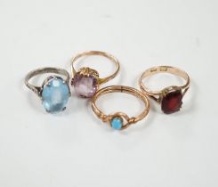 Two yellow metal and gem set rings, one stamped 9ct, gross weight 7.7 grams and two other rings.