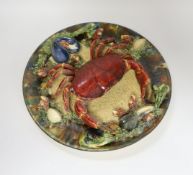 An Alvaro Jose Caldas Da Rainha Palissy ware dish, decorated in relief with a crab and shellfish,