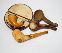 Three Meerschaum pipes, one 9ct gold mounted, one silver mounted, two cases