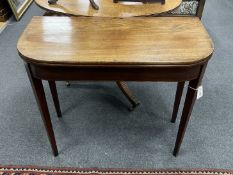 A George III mahogany D shaped folding tea table, width 85cm, depth 40cm, height 73cm