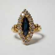 An Edwardian 18ct gold, sapphire and diamond cluster set marquise shaped ring, size K, gross