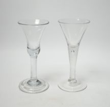 Two Georgian wine glasses, both with plain stems one with tear, the other with bell-shaped bowl