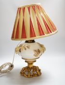 A Victorian porcelain oil lamp, probably Moore brothers, decorated with hops and gilt base,