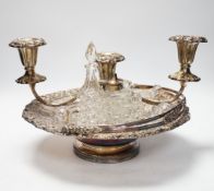 A pair of plated tureens, an oval tray, a basket, three branch candelabra, etc.