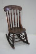 A Victorian elm and beech Windsor rocking chair, height 92cm