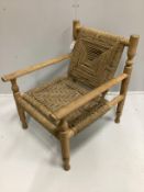 In the manner of Adrien Audoux and Frida Minet a sisal weave beech elbow chair, width 63cm, depth