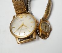 A lady's 18ct gold Plaza manual wind wrist watch, on a steel and gold plated flexible strap,