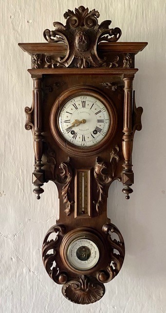 A late 19th century French carved walnut wall clock combined thermometer and barometer, dial and