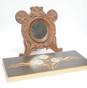 Two inlaid panels, a carved hardwood mirror and a scroll carving, largest 50.5cm wide