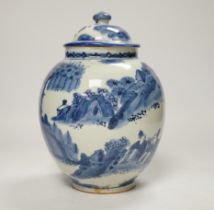 A 17th century Japanese Arita blue and white jar and cover, 22cm