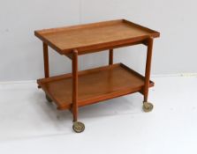 In the manner of Poul Hundevad, a mid century teak two tier tea trolley, width 75cm, depth 50cm,