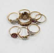 Eight assorted mainly modern 9ct gold and gem set dress rings, including diamond and garnet, 19.5