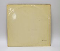 The Beatles; The White Album, top opening cover numbered 0557785, two LPs with set of four