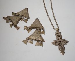 An Ethiopian white metal cross pendant necklace, overall 90cm, together with a pair of Tuareg