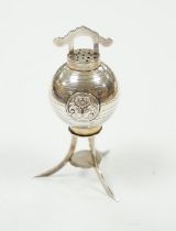 A 1920's continental silver pepperette, on tripod support, stamped sterling, import marks for