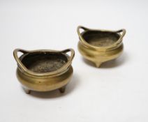 A pair of late 19th/early 20th century Chinese bronze censers, 8.5cm handle to handle
