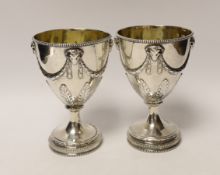 A pair of late George III silver goblets, with ram's head and swag decoration, maker H.G, London,