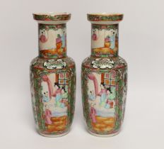 A pair of early 20th century Chinese famille rose vases, 26cm high